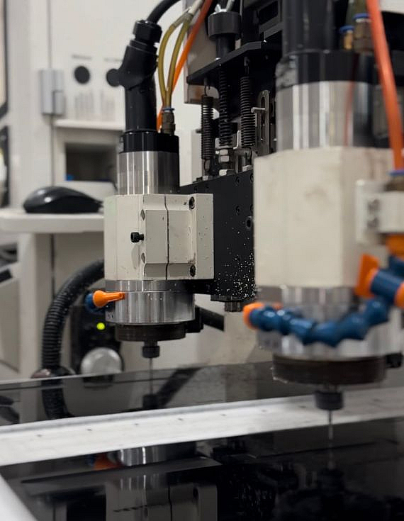 CNC machine cutting acetate board