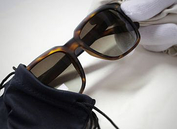 Acetate sunglasses packaged in a black cloth bag