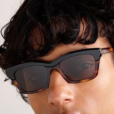 Model wearing tortoiseshell acetate sunglasses